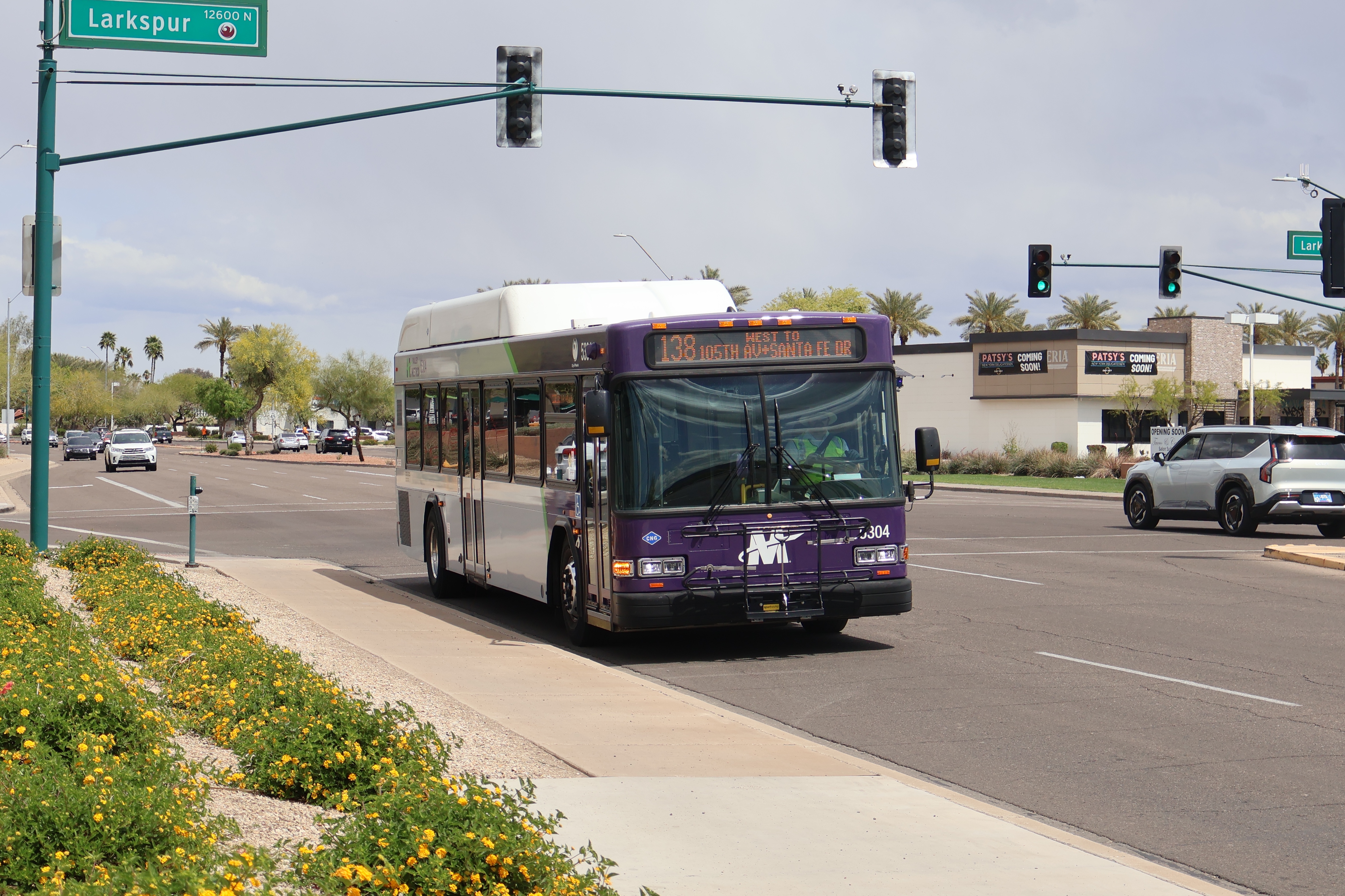A purple and gray Valley Metro bus, number 5304, traveling southbound on Tatum Boulevard in Phoenix on route 138 to Santa Fe Drive and 105th Drive