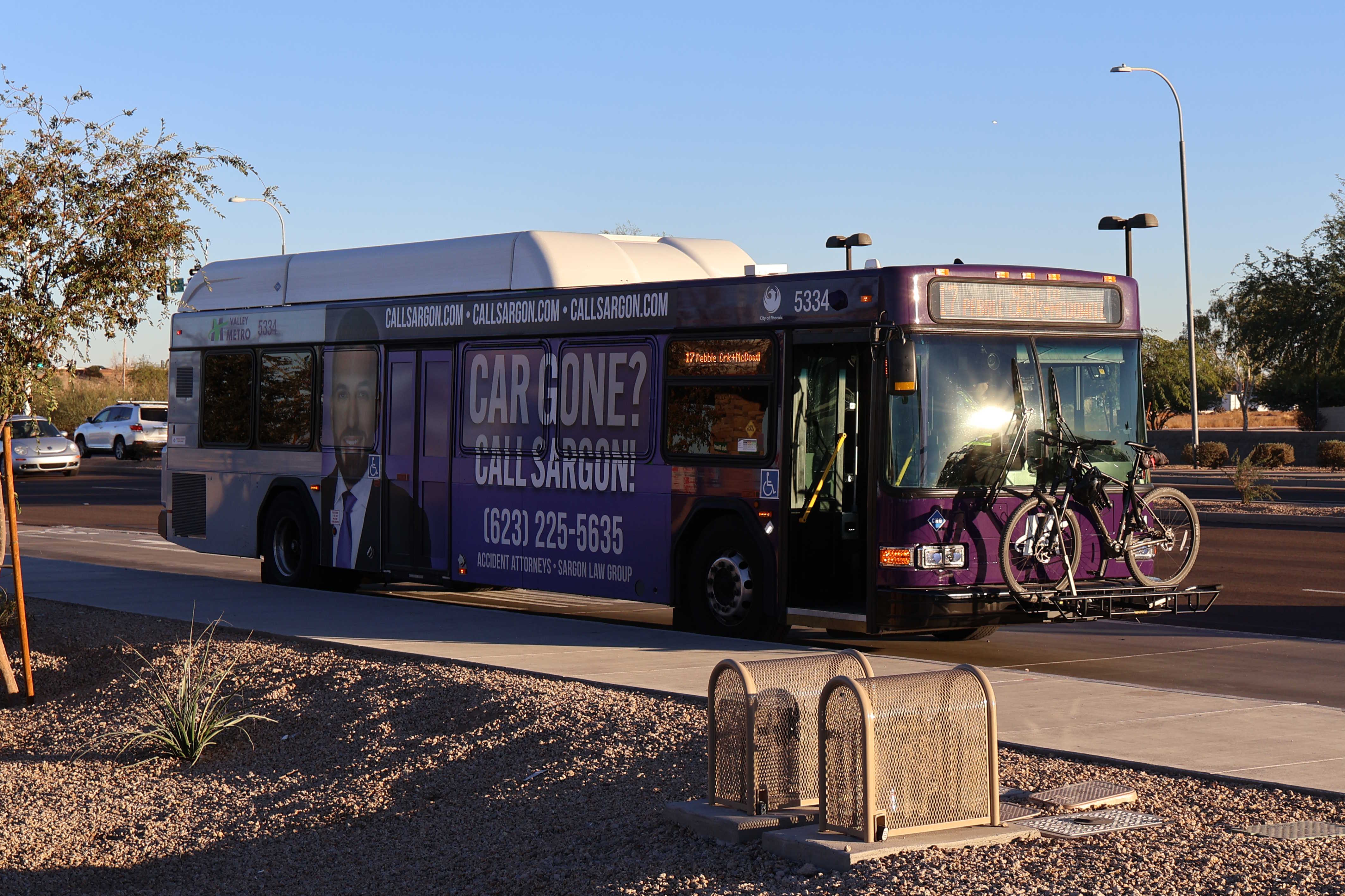 A purple and gray Valley Metro bus, number 5334, traveling westbound on McDowell Road in Scottsdale on route 17 to McDowell Road and Pebble Creek Parkway