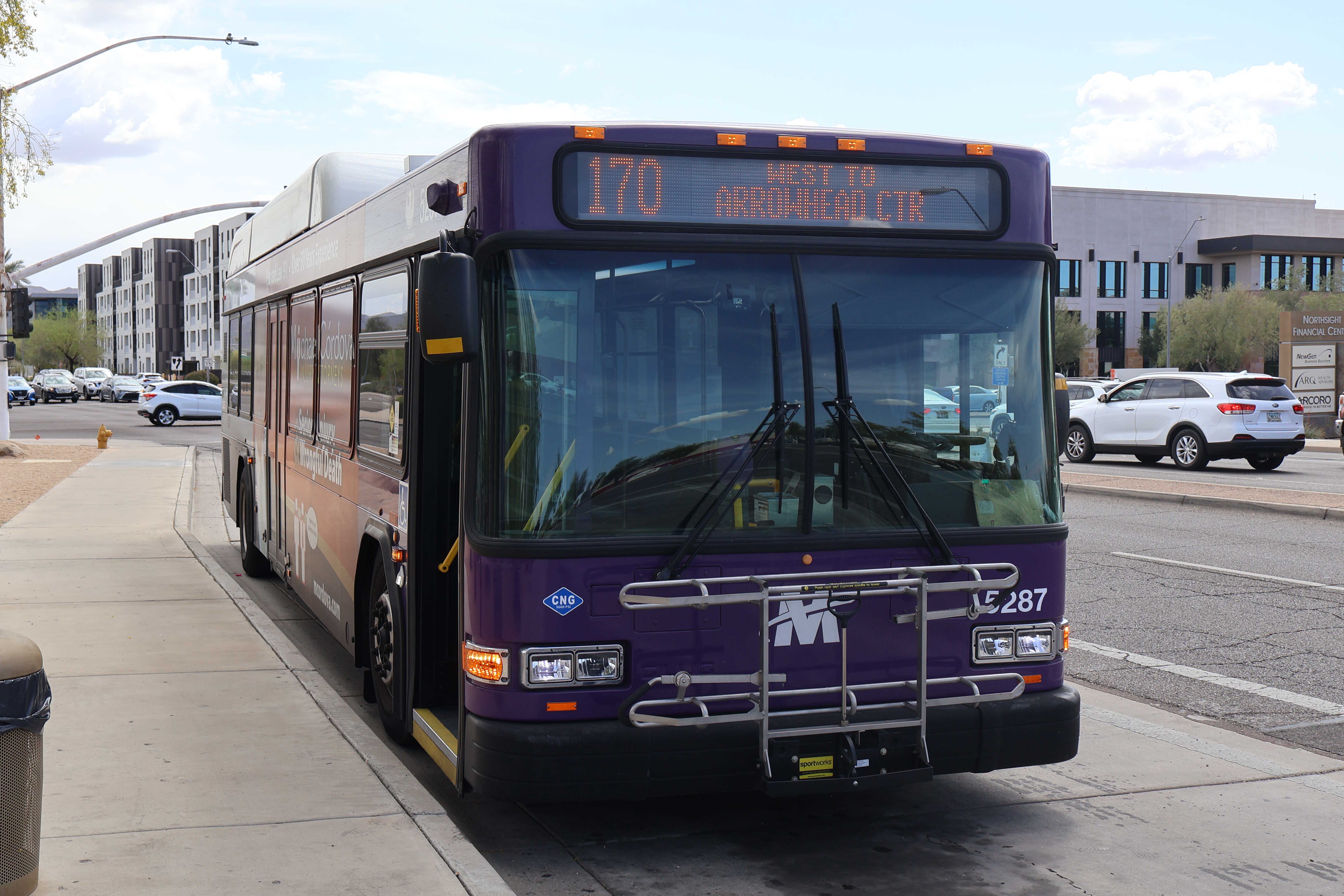 A purple and gray Valley Metro bus, number 5287, traveling westbound on Raintree Drive in Scottsdale on route 170 to Arrowhead Towne Center
