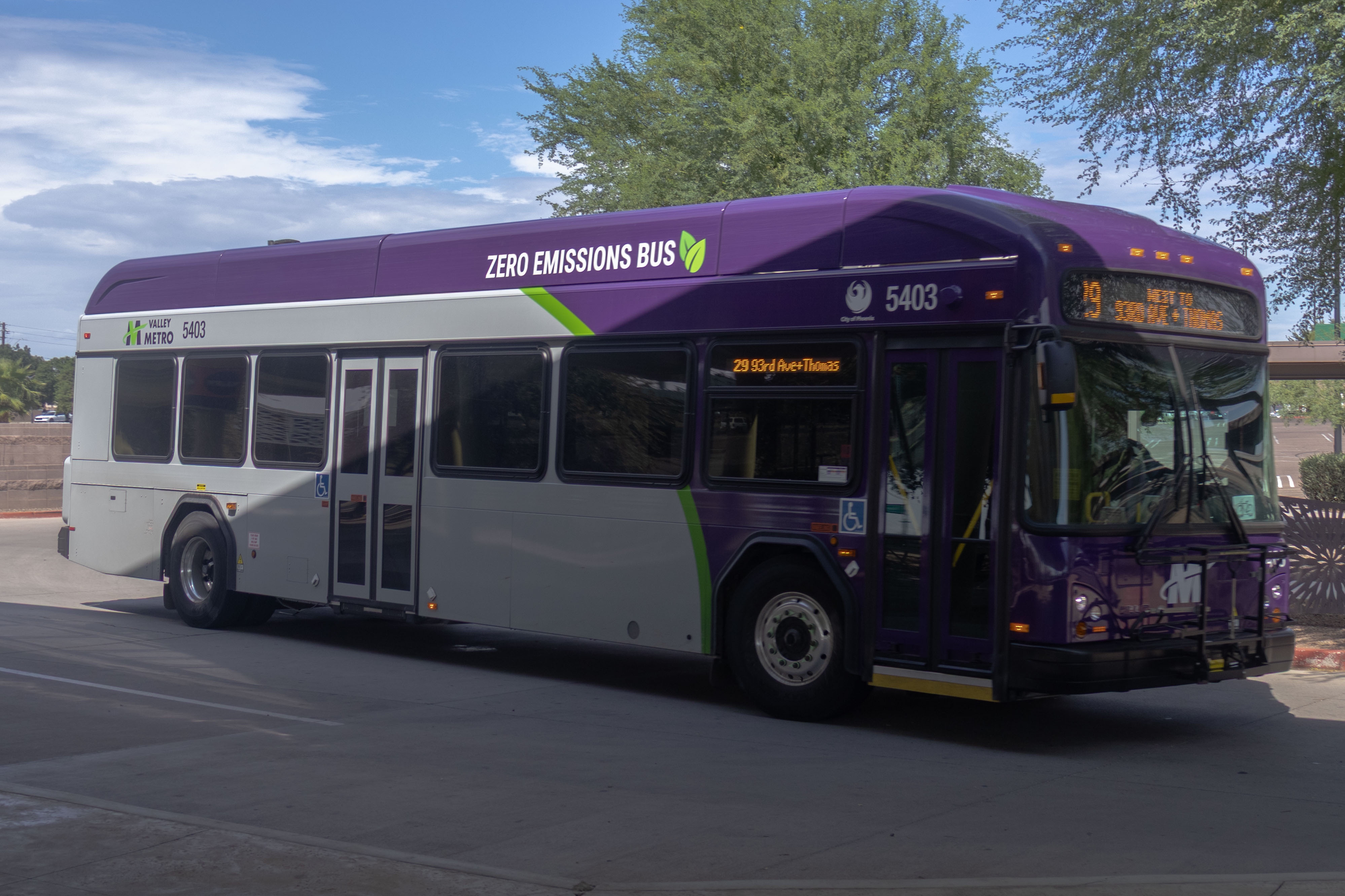 A purple and gray Valley Metro bus, with a green stripe, number 5403, at Desert Sky Transit Center in Phoenix on route 29 to Thomas Road and 93rd Avenue