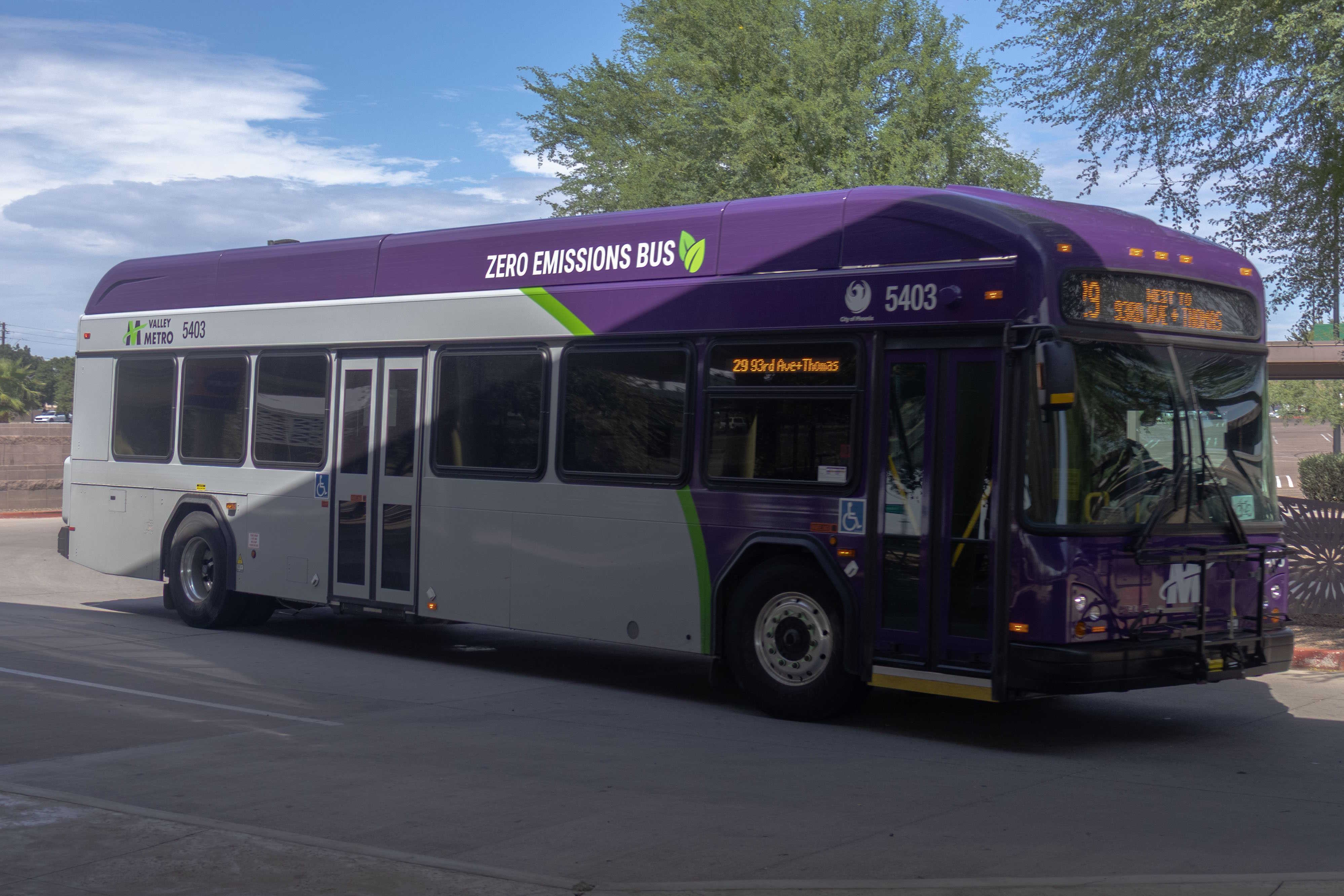 A purple and gray Valley Metro bus, with a green stripe, number 5403, at Desert Sky Transit Center in Phoenix on route 29 to Thomas Road and 93rd Avenue