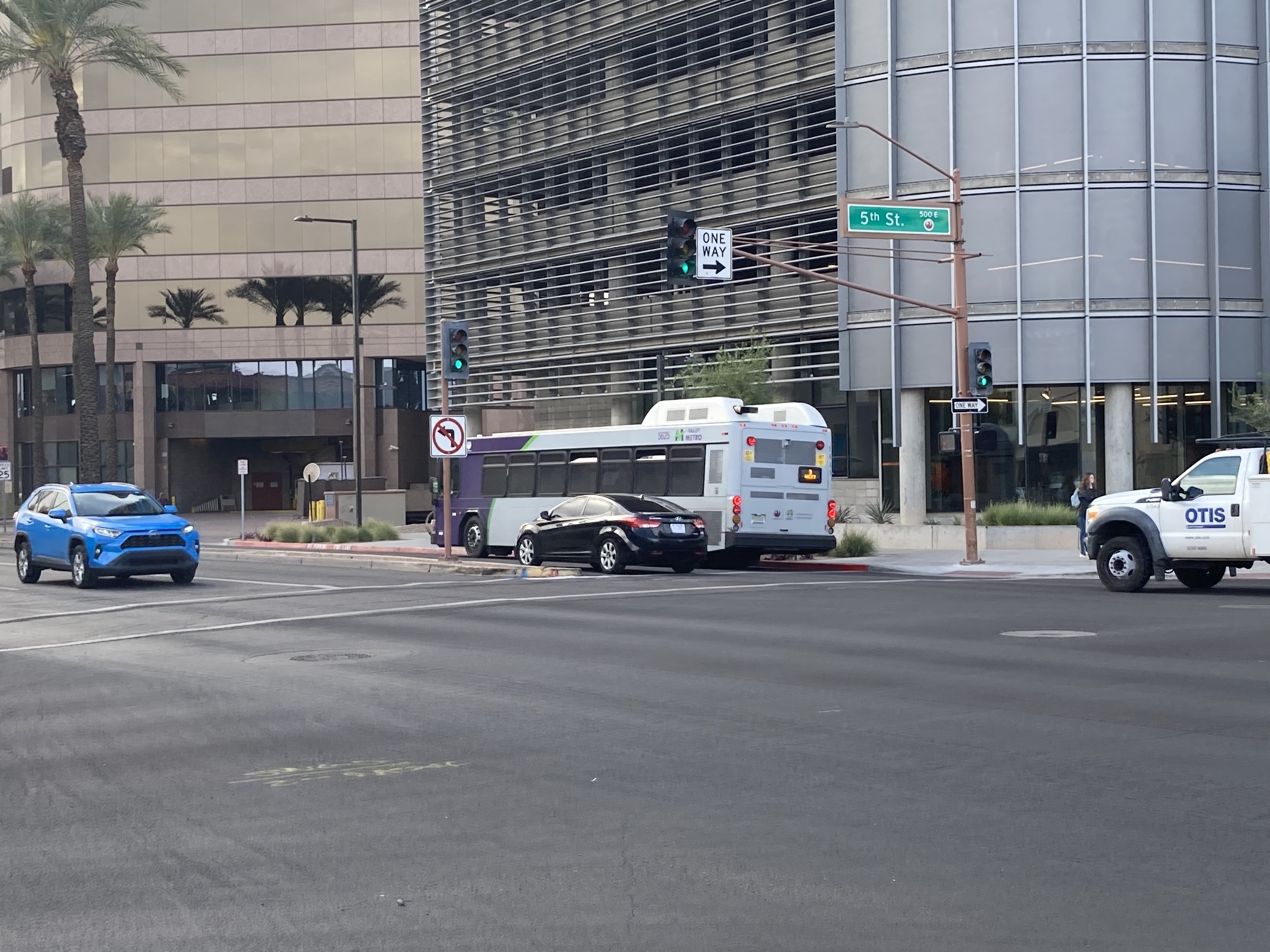 A purple and gray Valley Metro bus, number 5625, traveling westbound on Van Buren Street in Phoenix on route 3 to 4th Street and La Canada Boulevard