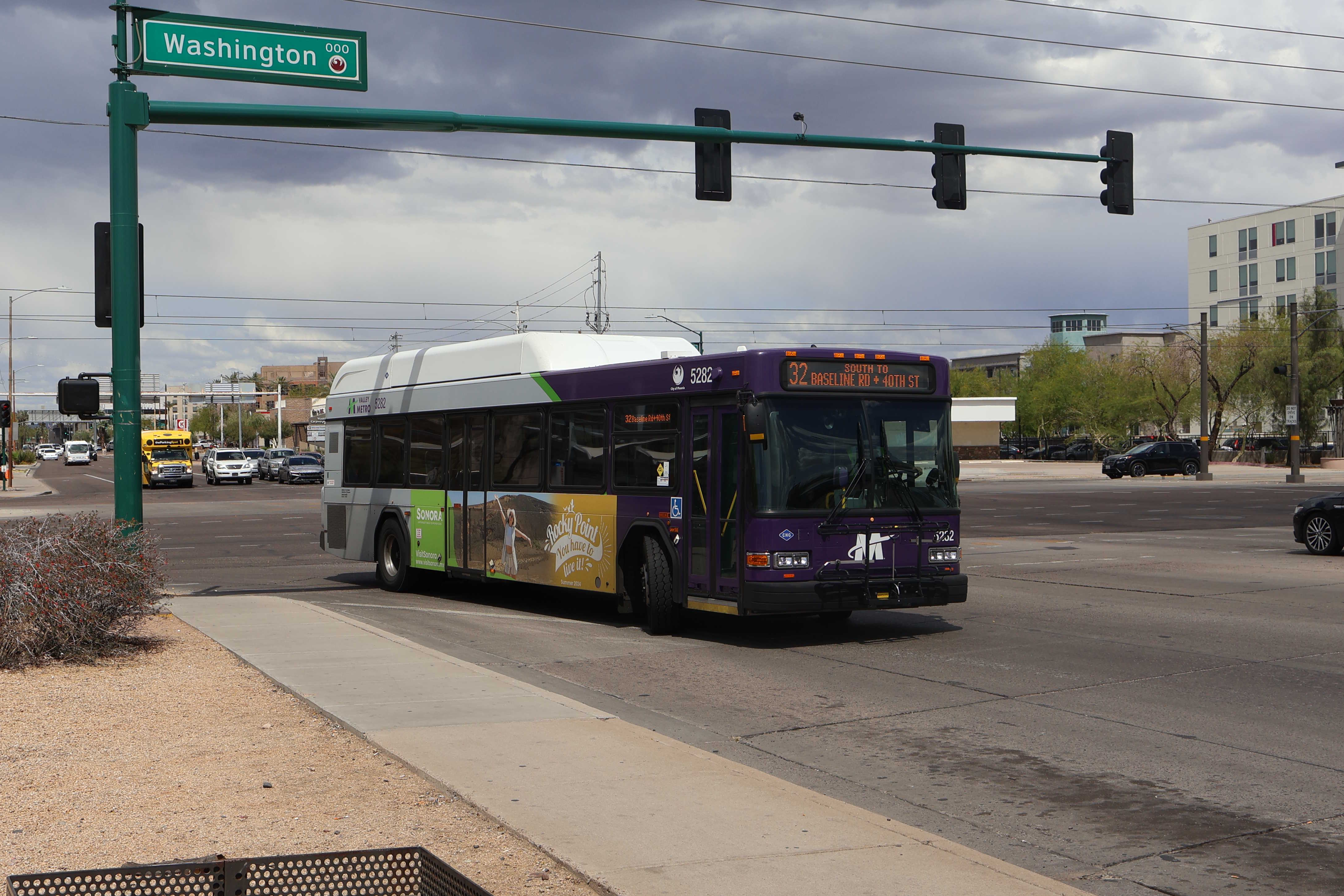 A purple and gray Valley Metro bus, number 5282, traveling southbound on 44th Street in Phoenix on route 32 to 40th Street and Baseline Road