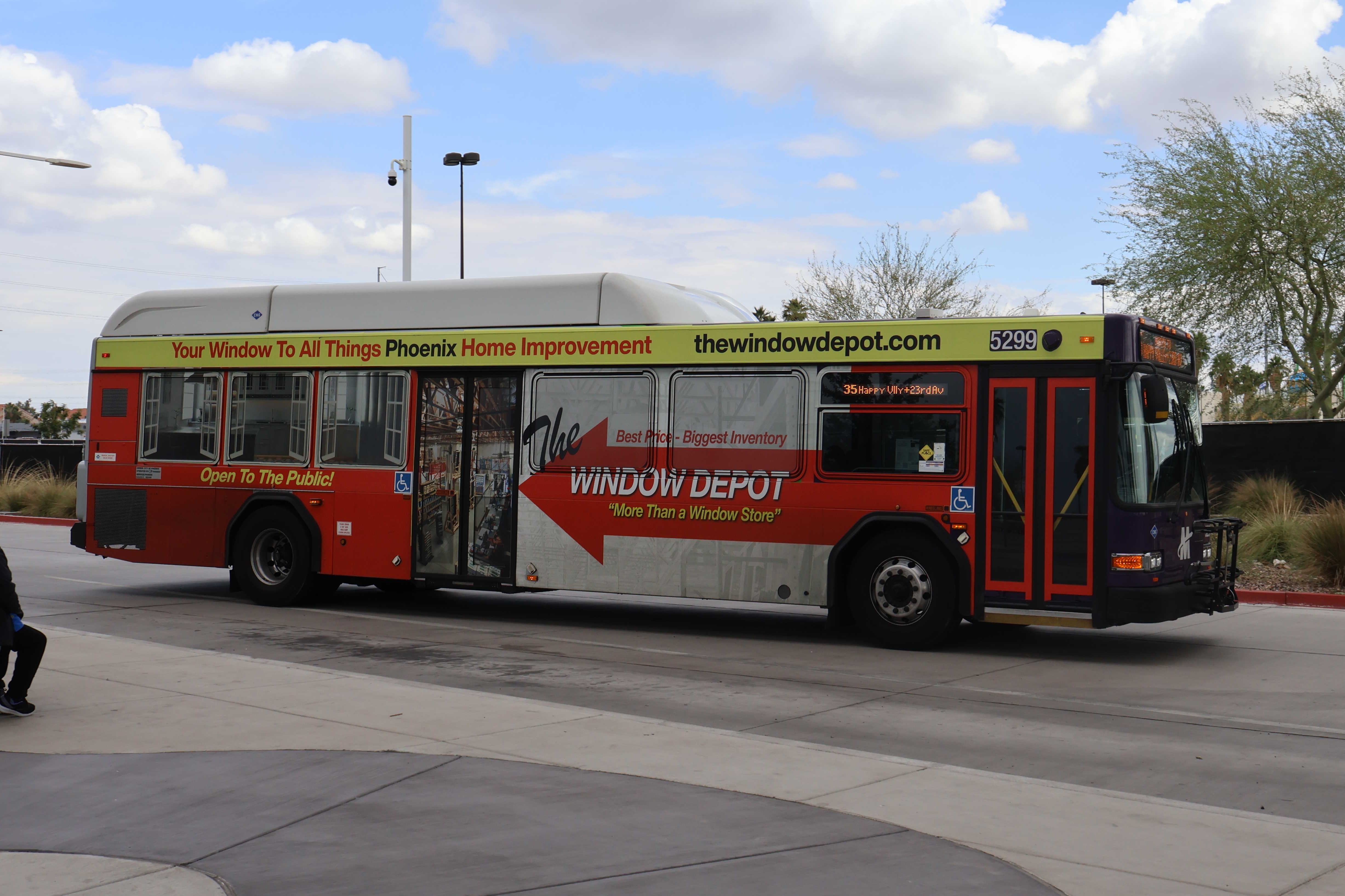 A purple and gray Valley Metro bus, number 5299, at Thelda Williams Transit Center in Phoenix on route 35 to Happy Valley Road and 23rd Avenue