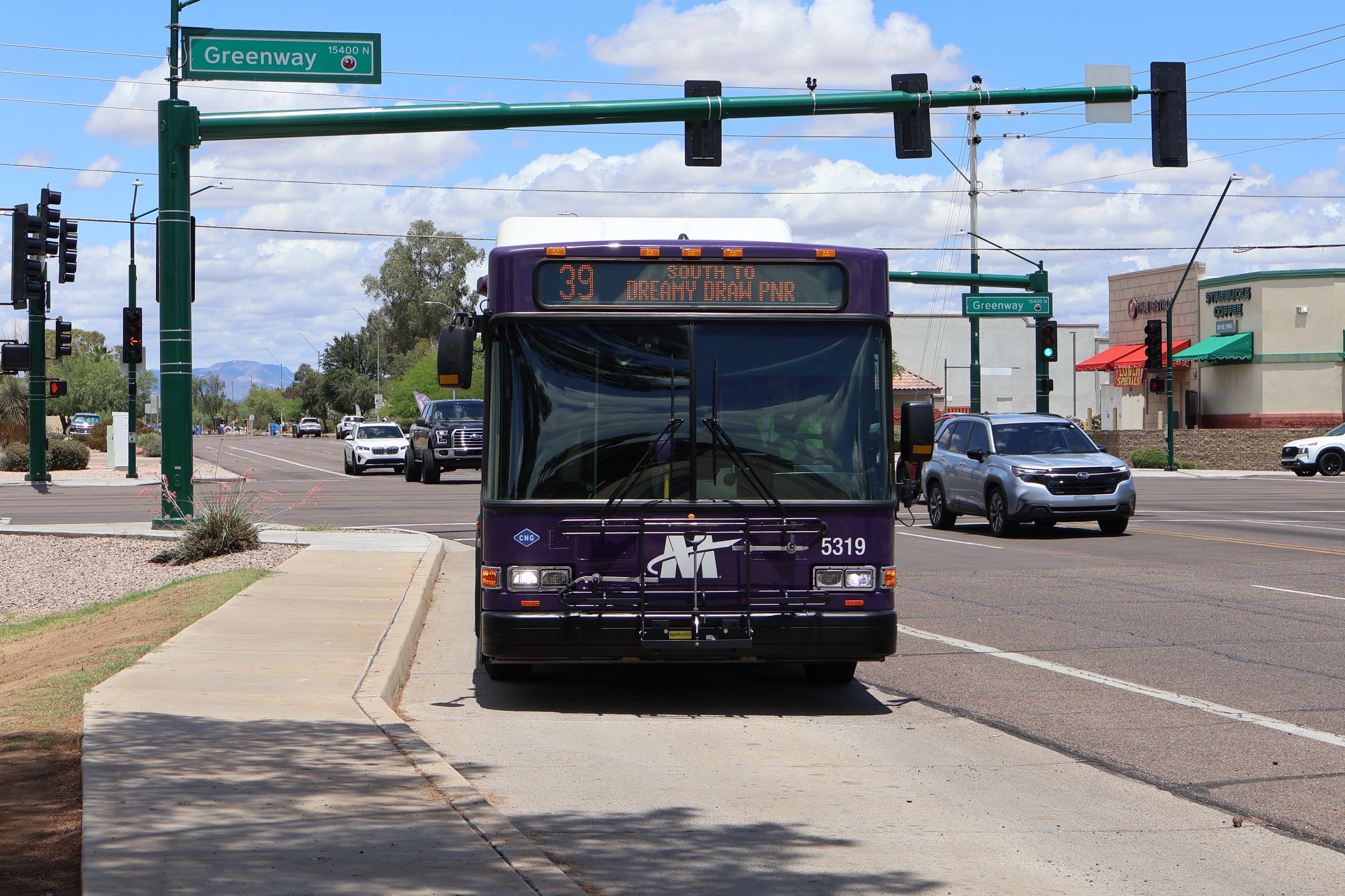 A purple and gray Valley Metro bus, number 5319, traveling southbound on 40th Street in Phoenix on route 39 to Dreamy Draw Park and Ride
