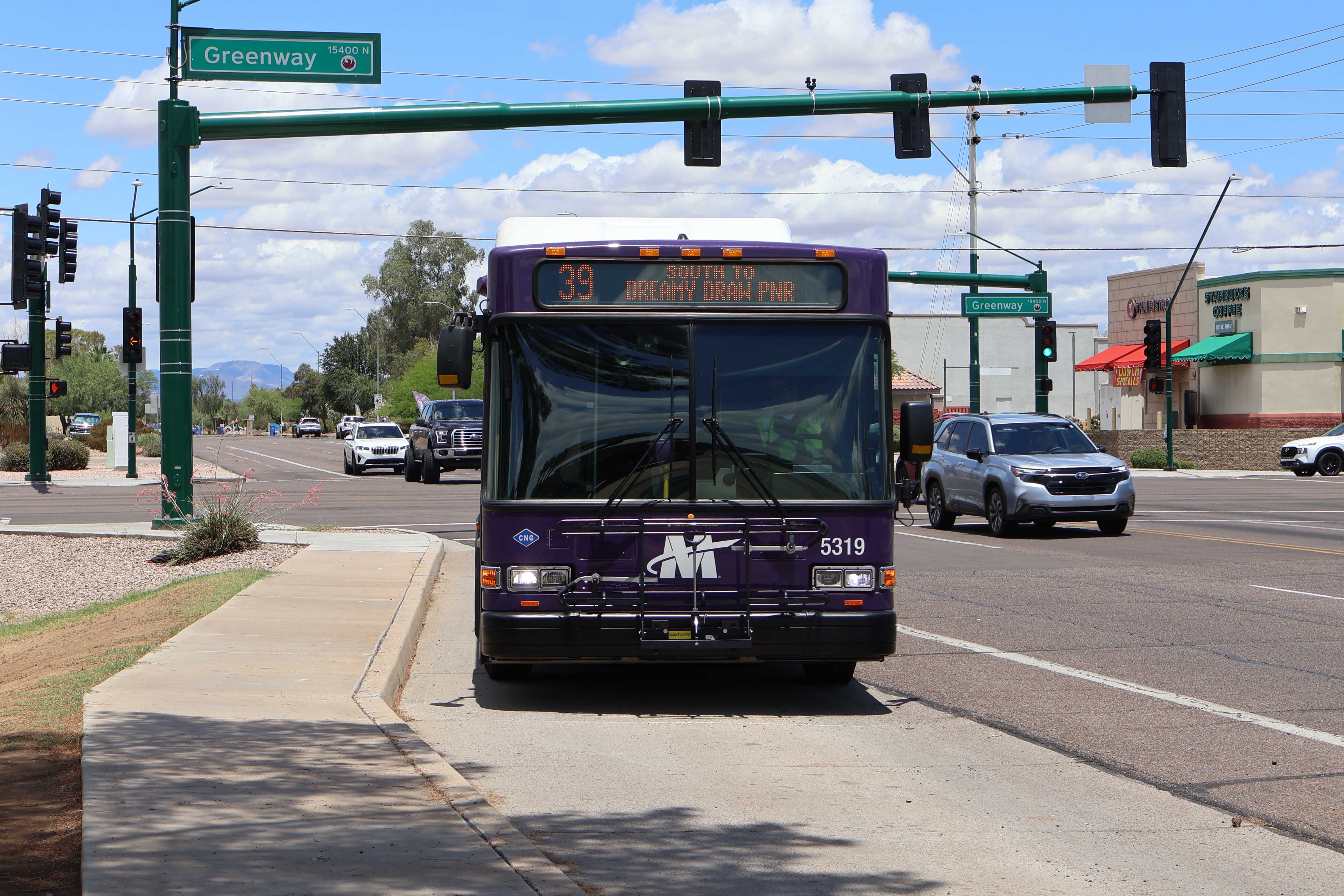 A purple and gray Valley Metro bus, number 5319, traveling southbound on 40th Street in Phoenix on route 39 to Dreamy Draw Park and Ride