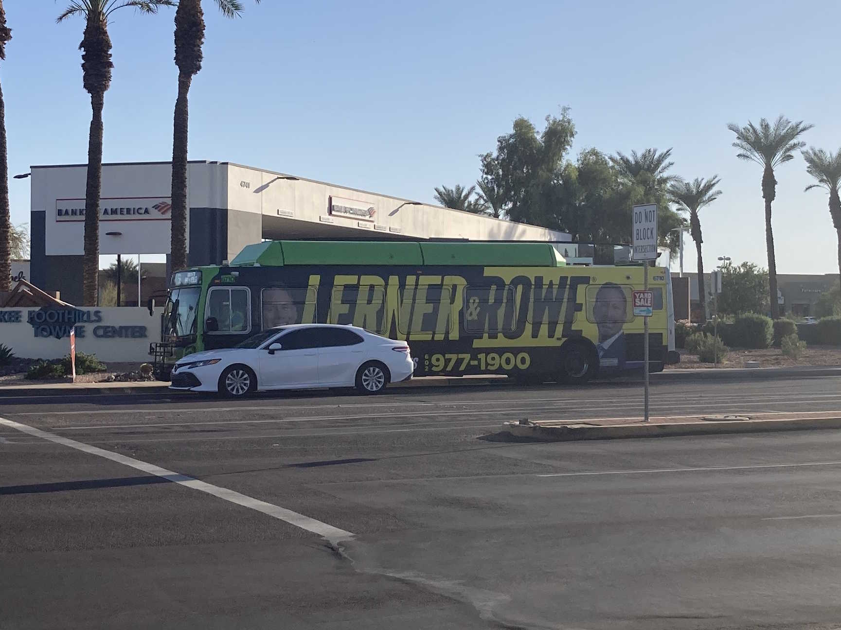 A green Valley Metro bus, number 6710, traveling eastbound on Ray Road on route 56 to Ray Road & 48th Street