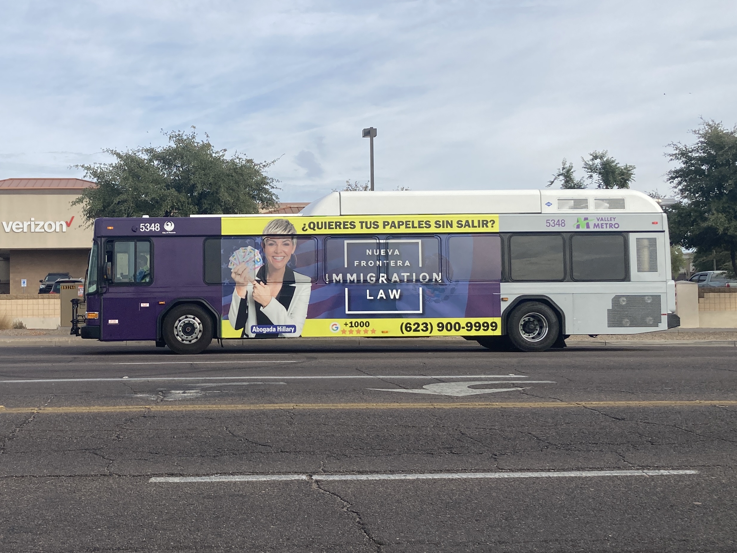 A purple and gray Valley Metro bus, number 5348, traveling northbound on 59th Avenue in Glendale on route 59 to 59th Avenue and Beardsley Road