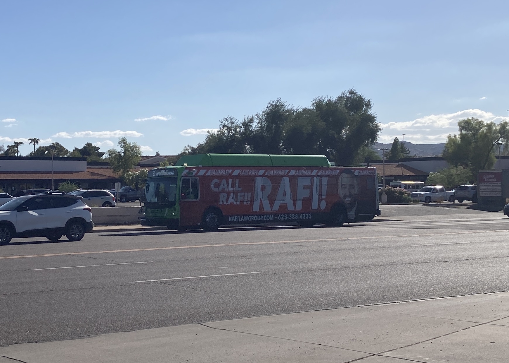 A green Valley Metro bus, number 6709, traveling eastbound on Southern Avenue on route 61 to Superstition Springs Transit Center