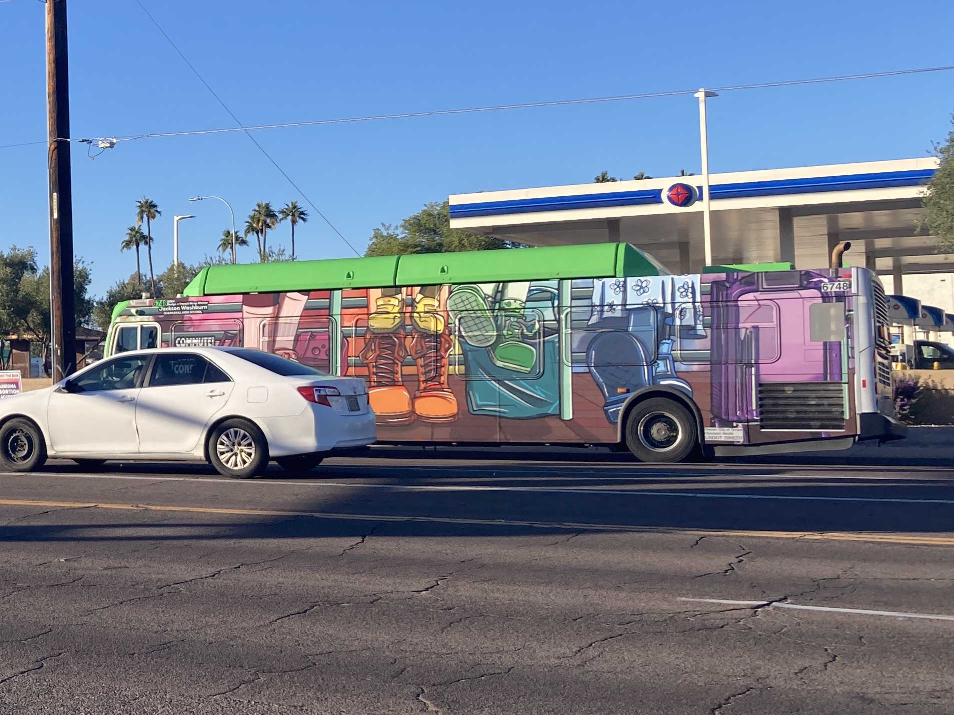 A gray and green Valley Metro bus, number 6748, traveling westbound on Southern Avenue in Tempe on route 61 to Southern Avenue and 51st Avenue