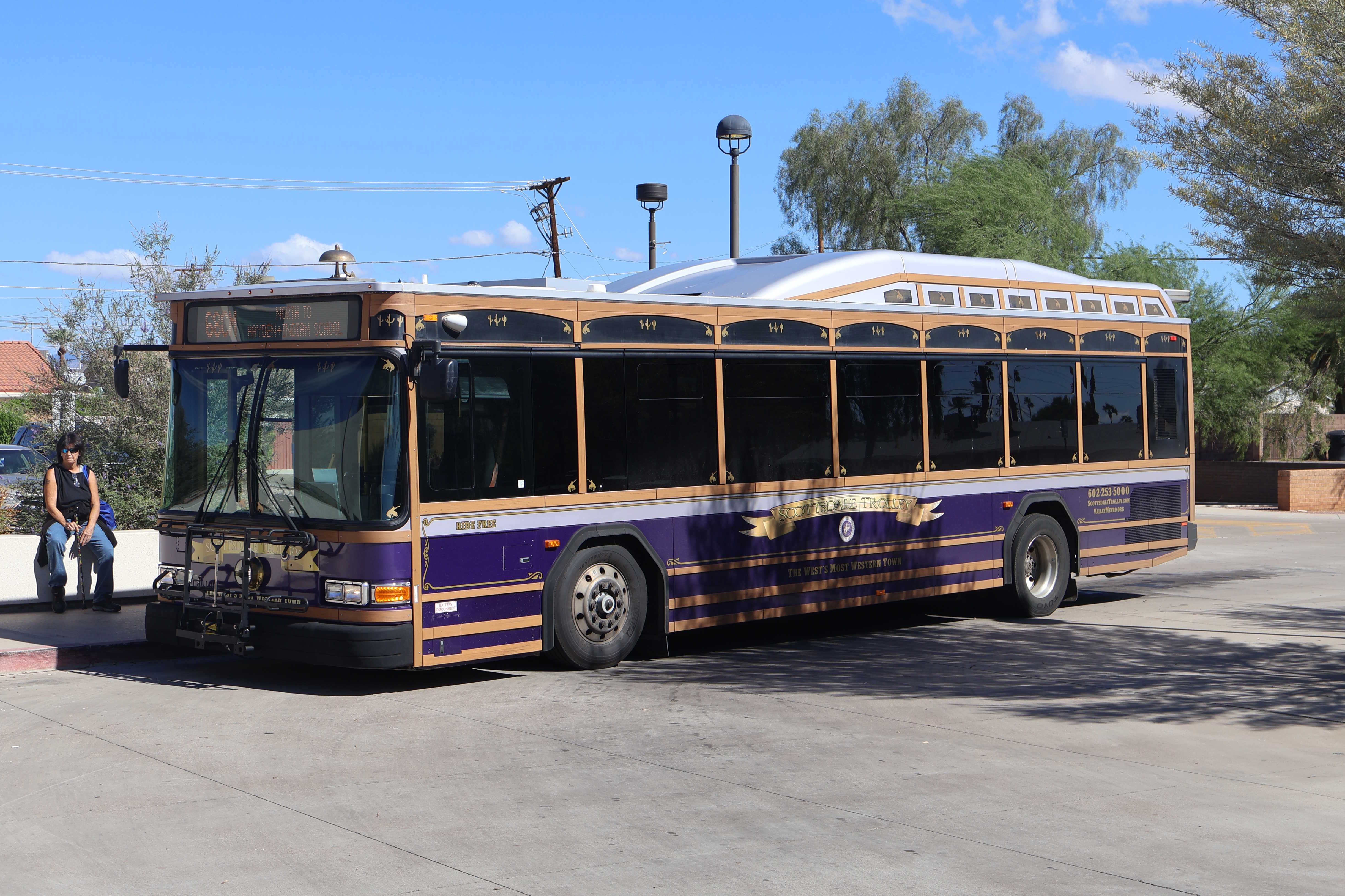 A purple, brown, and silver Scottsdale Trolley bus, number 4512, at Granite Reef Senior Center on the 68th Street/Camelback Trolley route to Indian School Road and Hayden Road