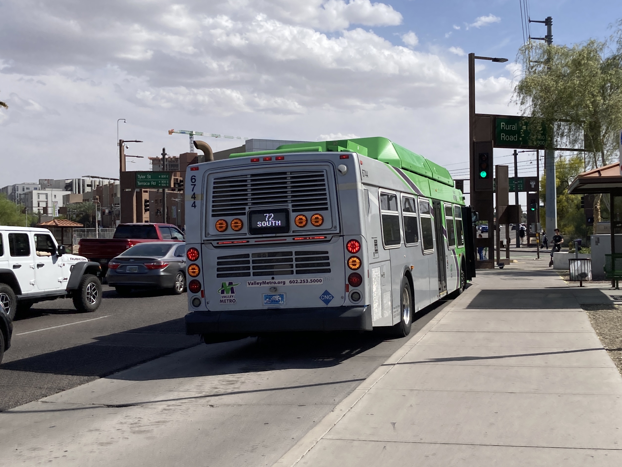 A green Valley Metro bus, number 6744, traveling southbound on Rural Road in Tempe on route 72 to Chandler Fashion Center