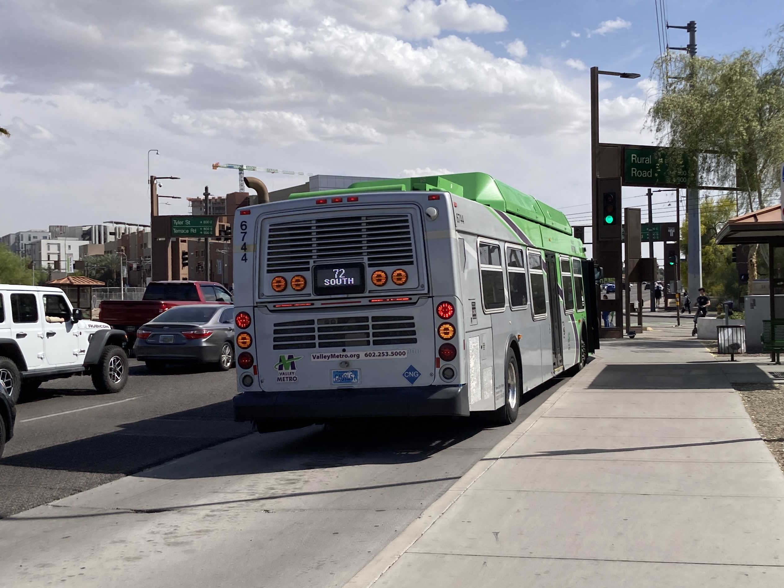 A green Valley Metro bus, number 6744, traveling southbound on Rural Road in Tempe on route 72 to Chandler Fashion Center