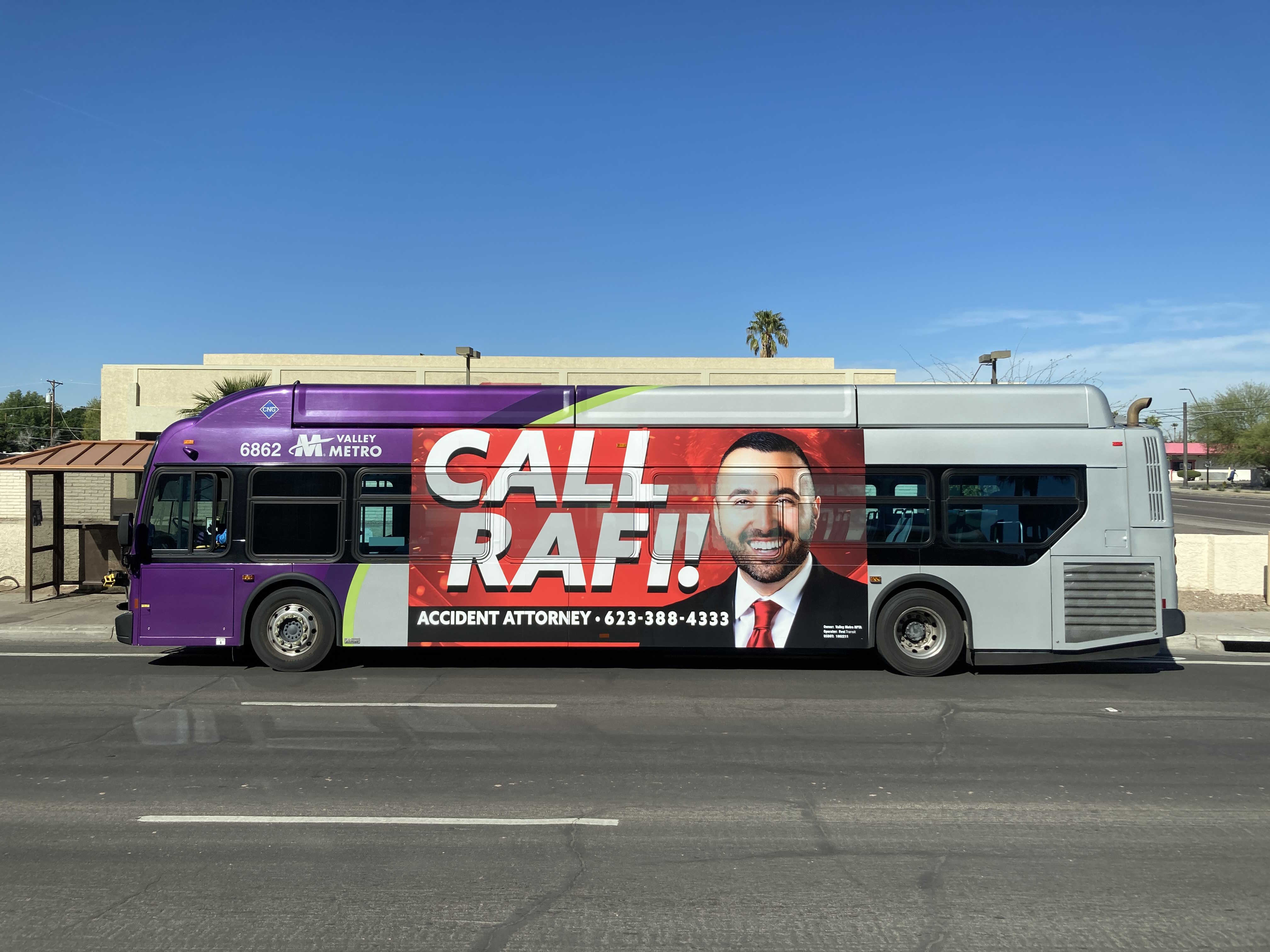 A gray and purple Valley Metro bus with a green stripe, number 6862, traveling southbound on McClintock Drive in Tempe on route 81 to Chandler Fashion Center