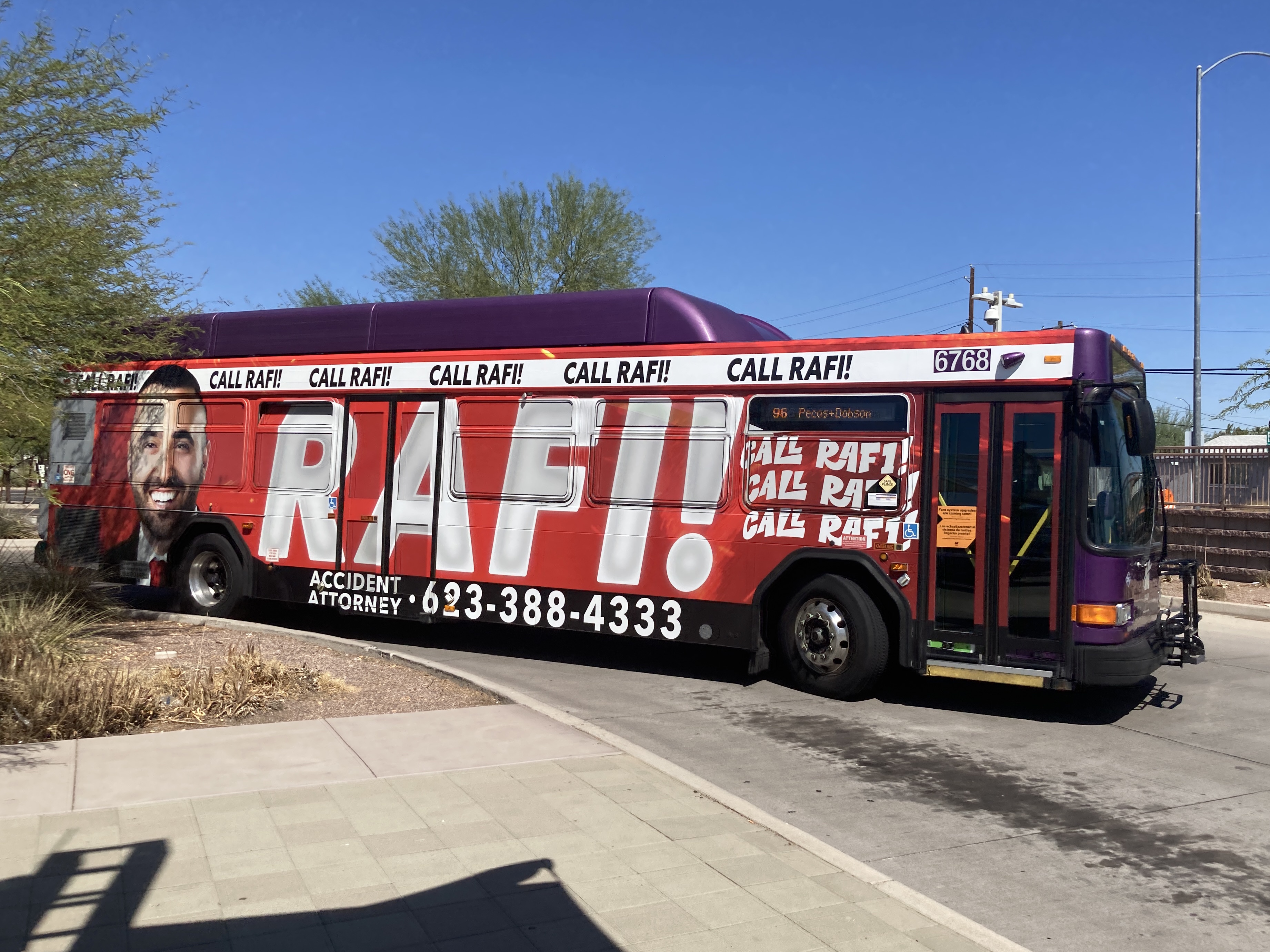 A gray and purple Valley Metro bus with a white and green stripe, number 6768, at Sycamore / Main Street Transit Center in Mesa on route 96 to Dobson Road and Pecos Road