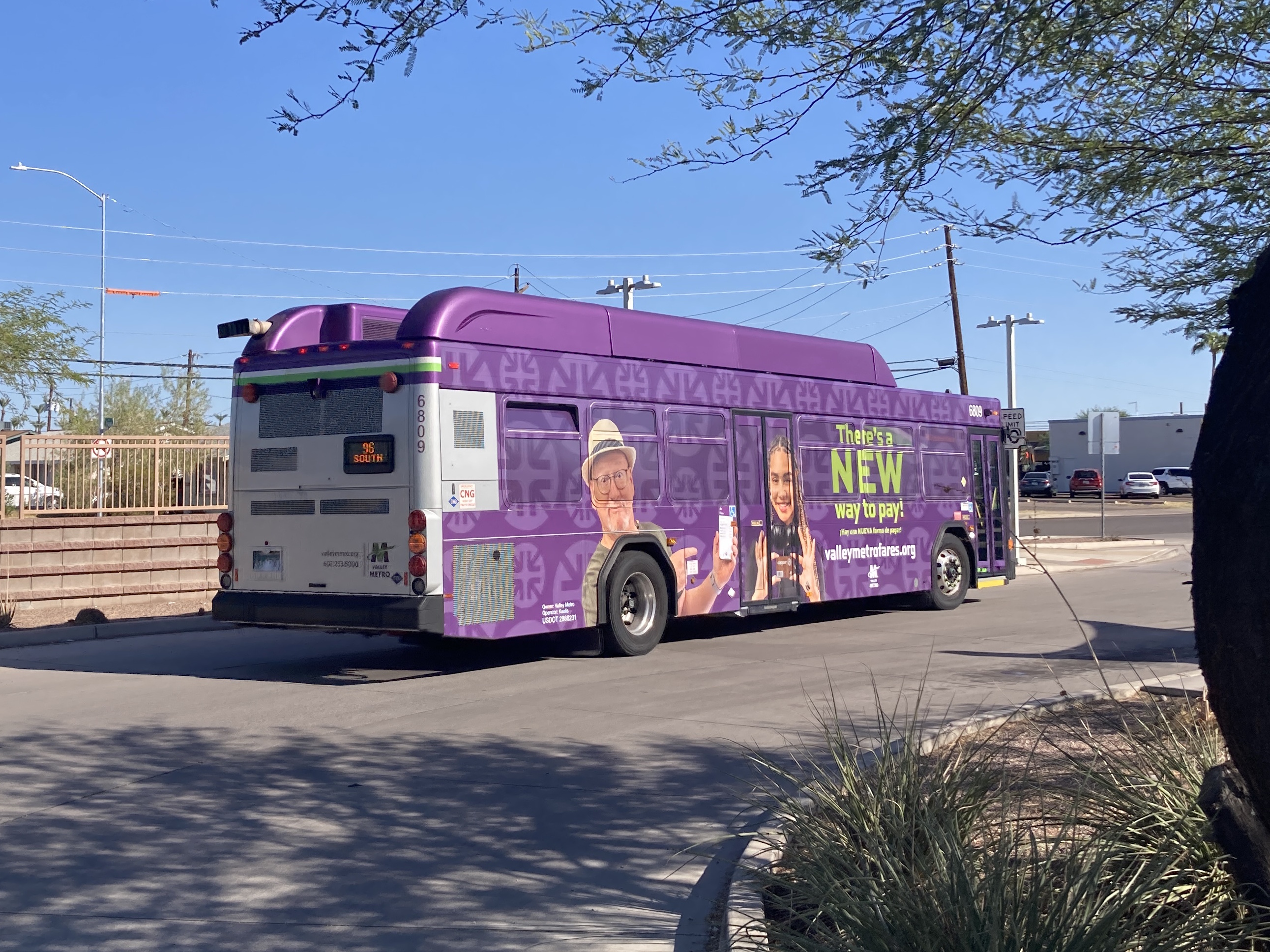 A gray and purple Valley Metro bus with a white and green stripe, number 6809, at Sycamore / Main Street Transit Center in Mesa on route 96 to Dobson Road and Pecos Road