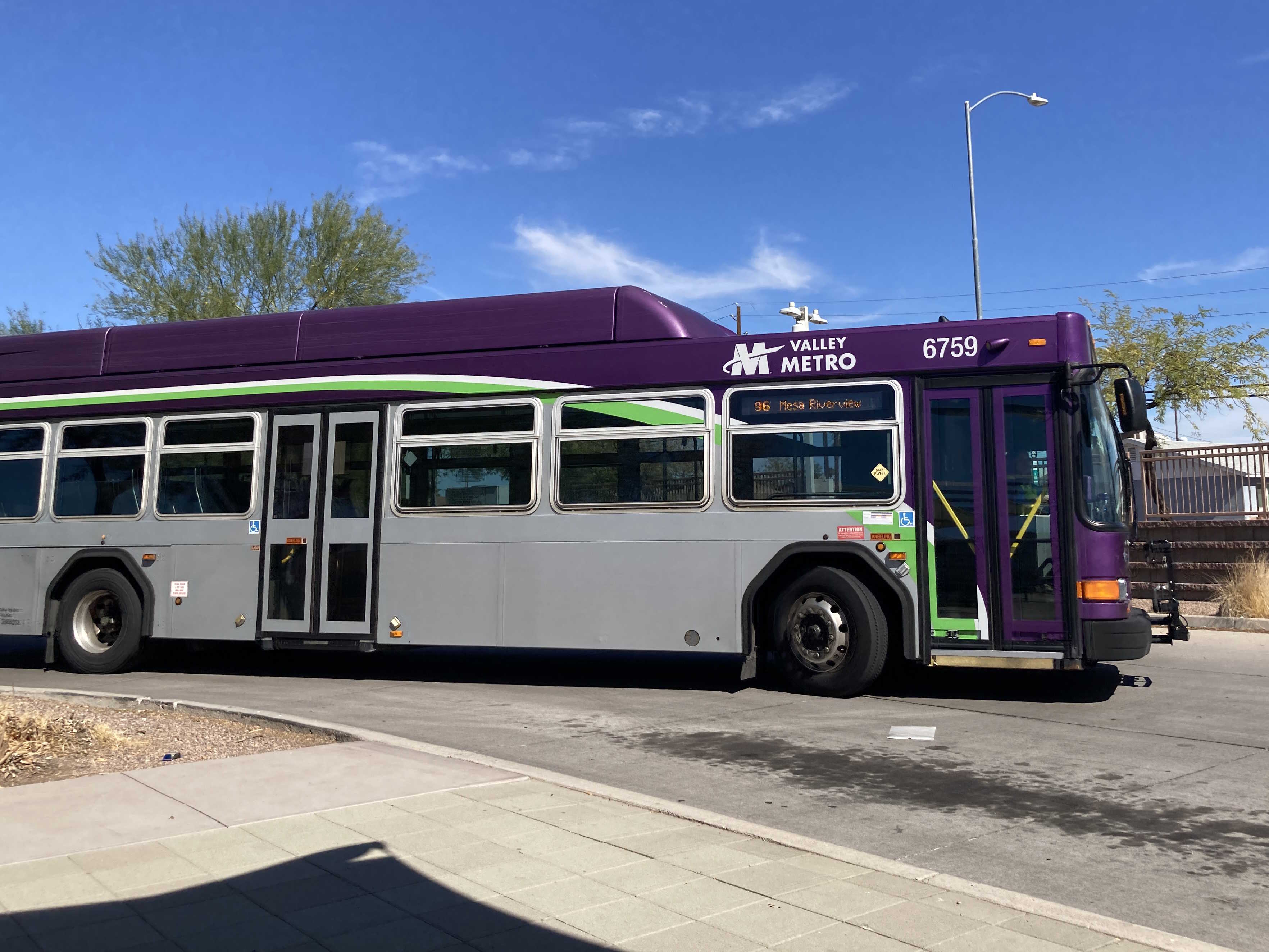 A gray and purple Valley Metro bus with a white and green stripe, number 6759, at Sycamore / Main Street Transit Center in Mesa on route 96 to Mesa Riverview