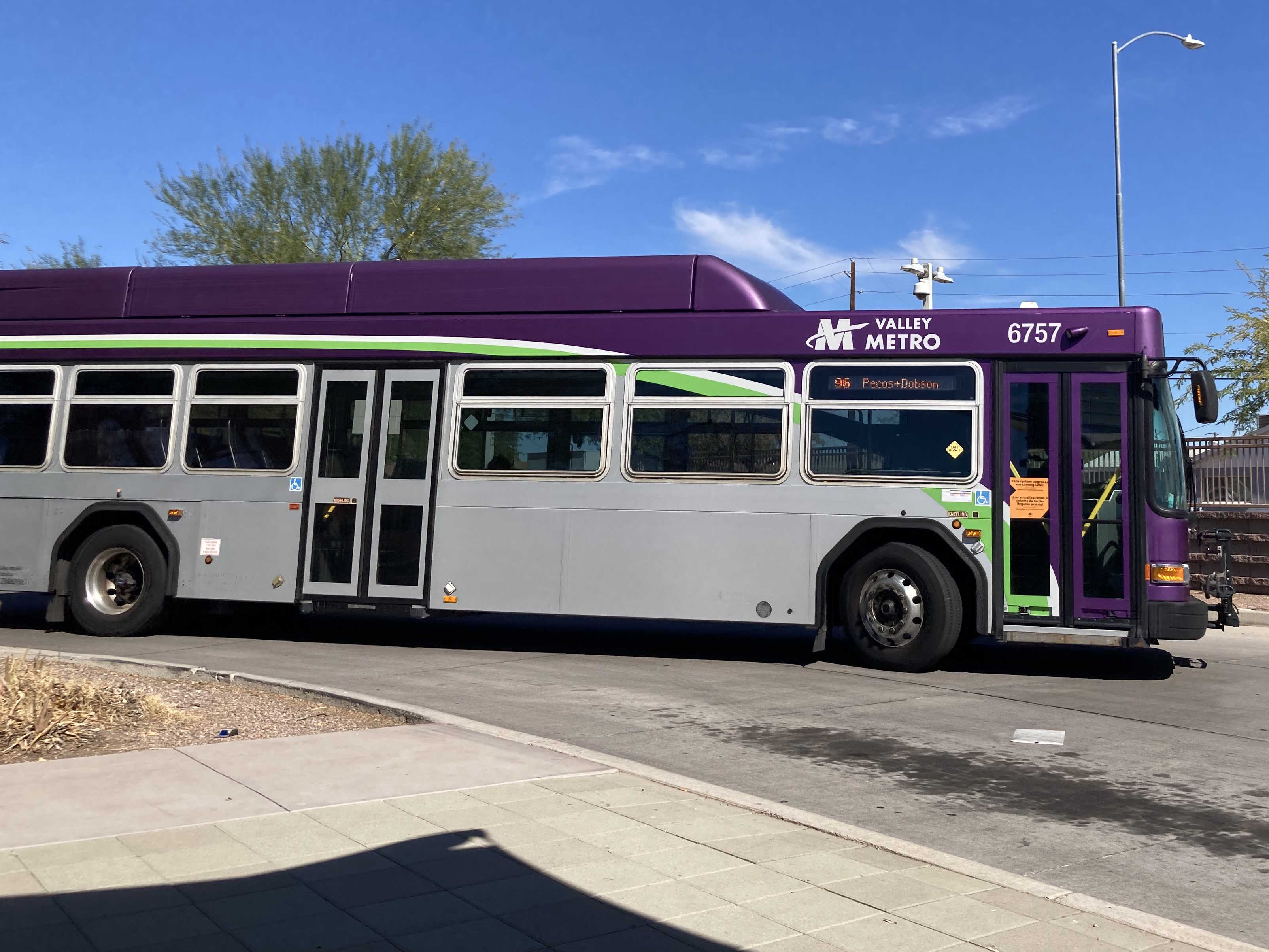 A gray and purple Valley Metro bus with a white and green stripe, number 6757, at Sycamore / Main Street Transit Center in Mesa on route 96 to Dobson Road and Pecos Road