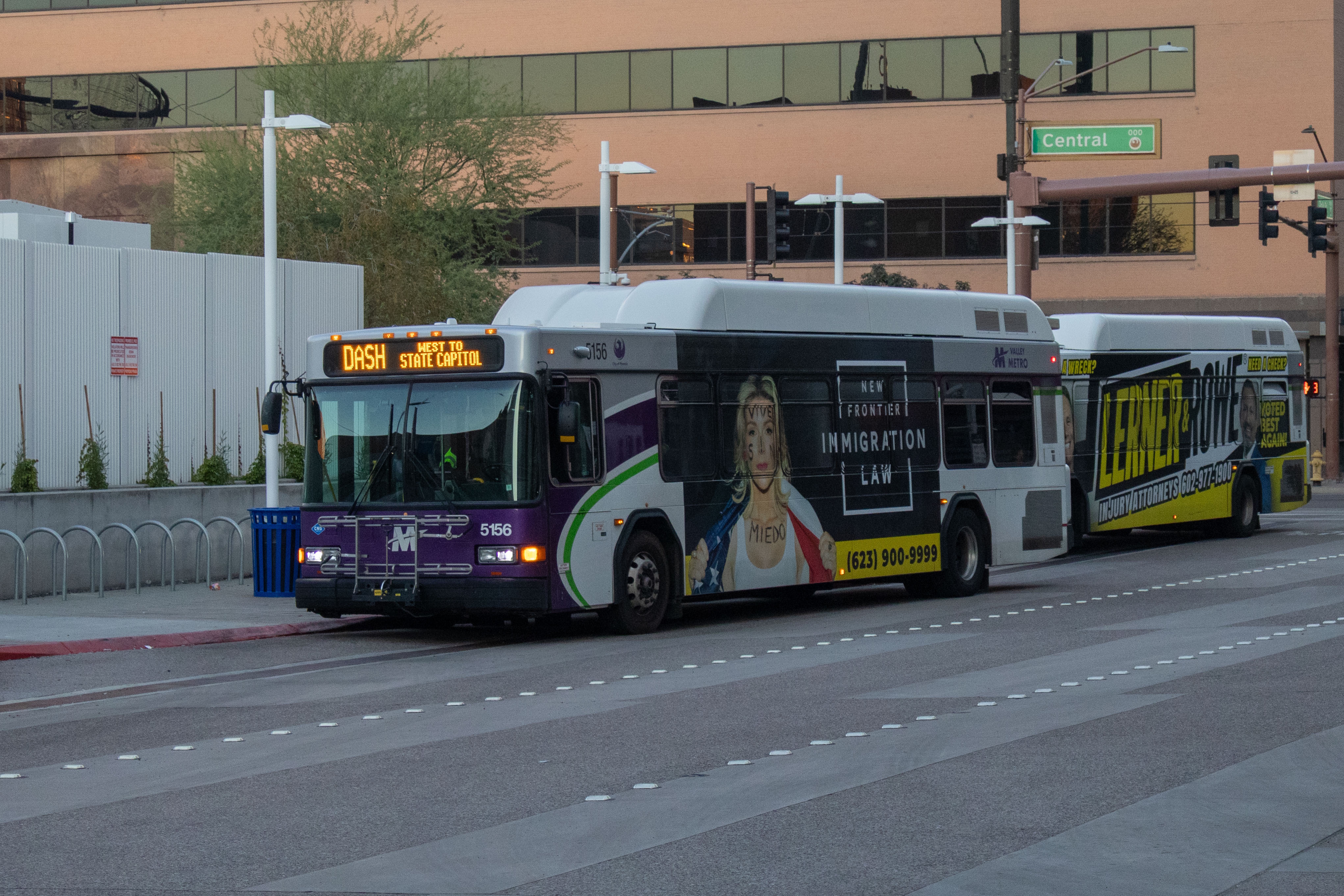 A white and gray Valley Metro bus, with purple and green accent colors, number 5156, at Greg Stanton Central Station in Phoenix on the DASH route to State Capitol