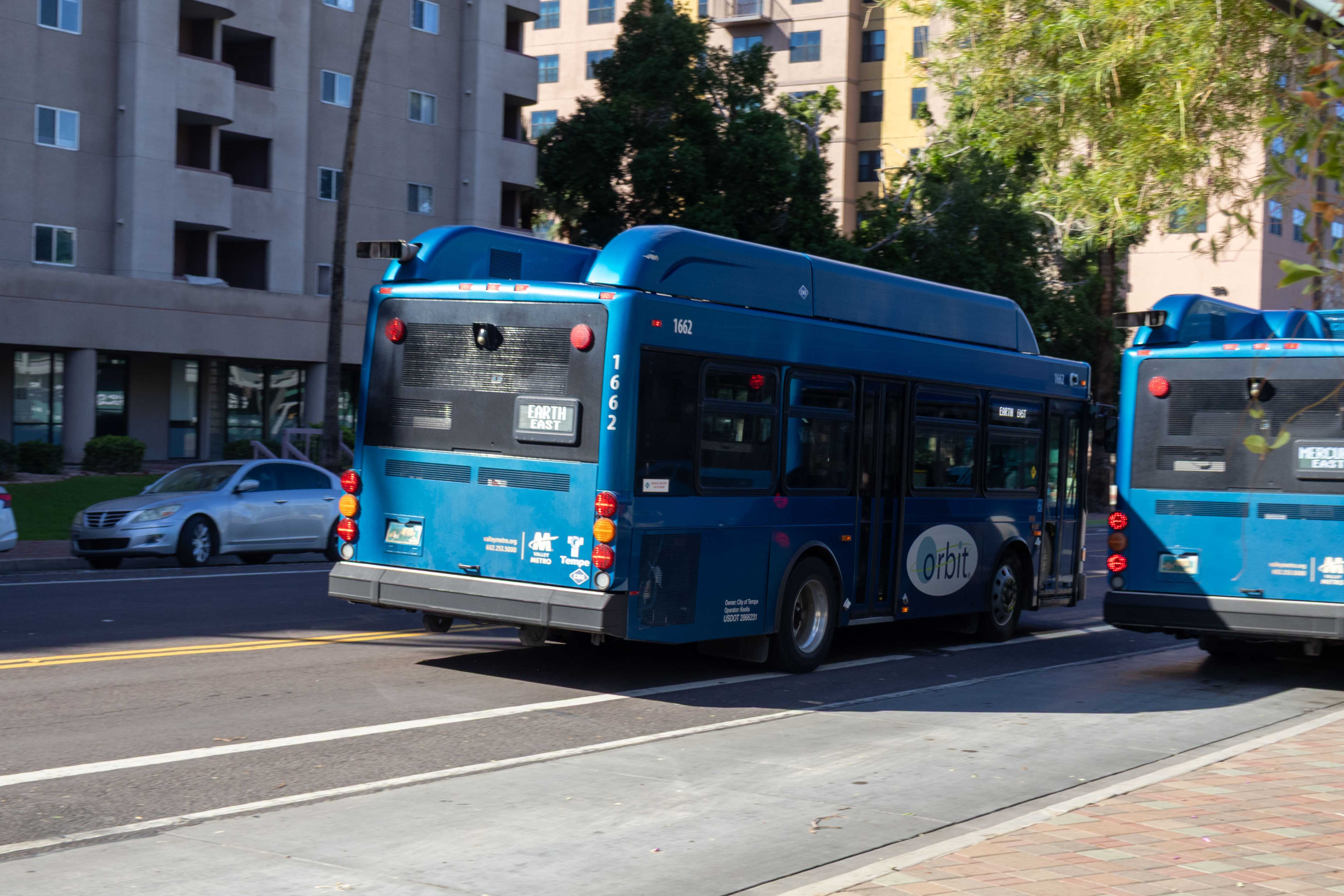 A blue Orbit bus, number 1662, traveling westbound on 5th Street on the Earth route to Tempe Marketplace