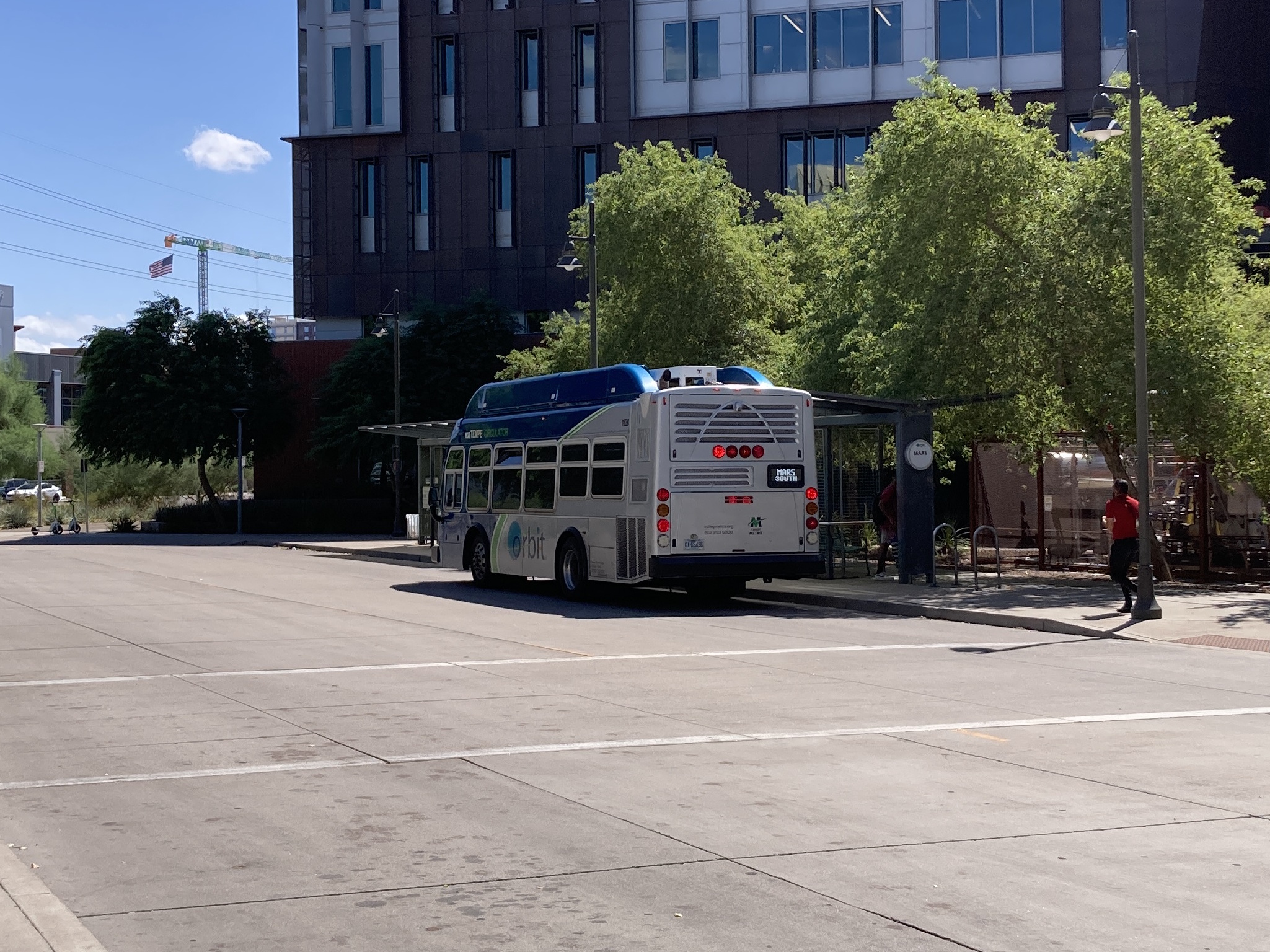 A gray and blue Orbit bus, with a green stripe, number 1638, at the University and Rural Transit Center on the Mars route to Evergreen Road and Southern Avenue