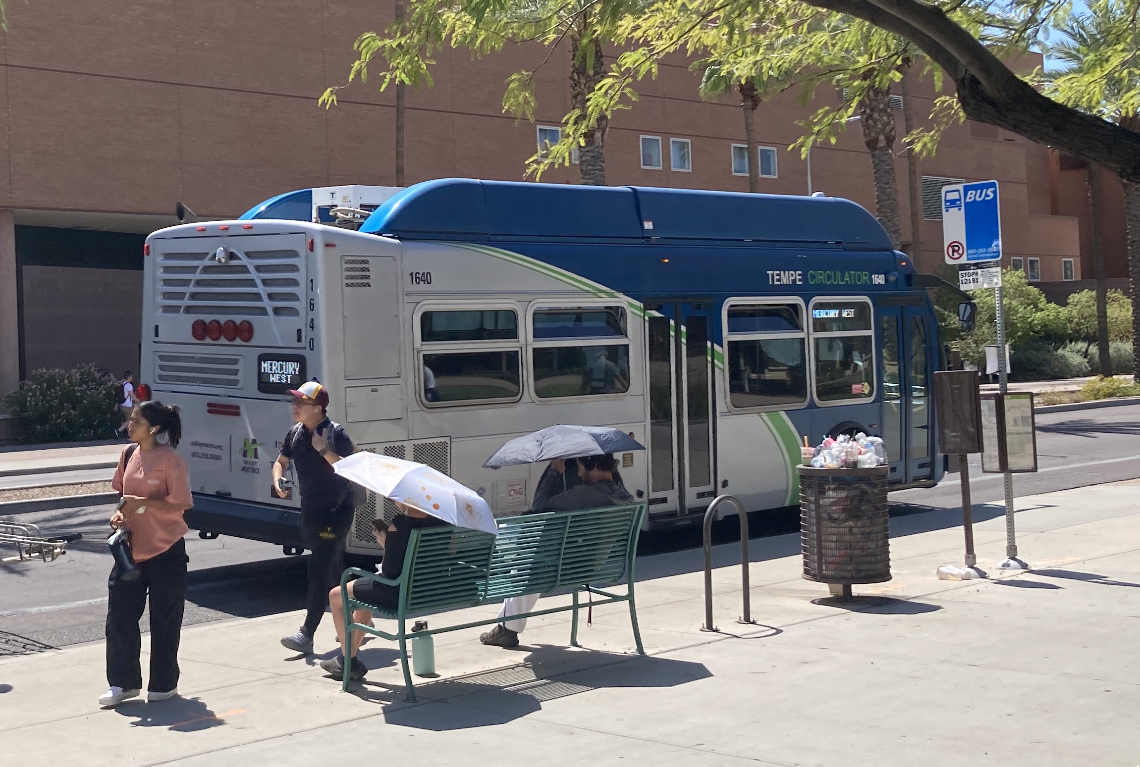 A gray and blue Orbit bus, with a green stripe, number 1640, traveling westbound on University Drive on the Mercury route to Tempe Transportation Center