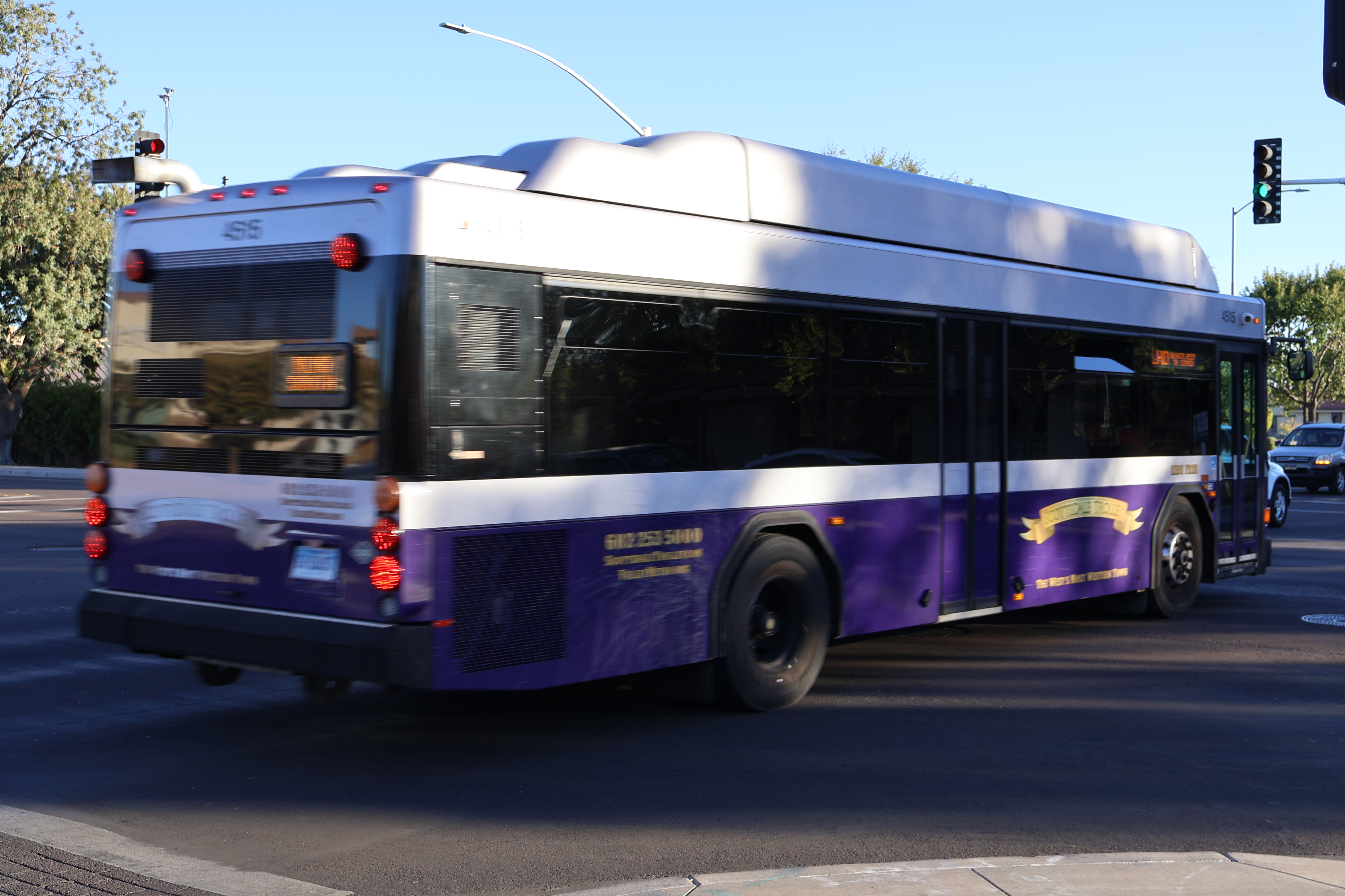 A purple and silver Scottsdale Trolley bus, number 4515, traveling southbound on Miller Road on the Miller/Hayden Trolley route to Granite Reef Senior Center