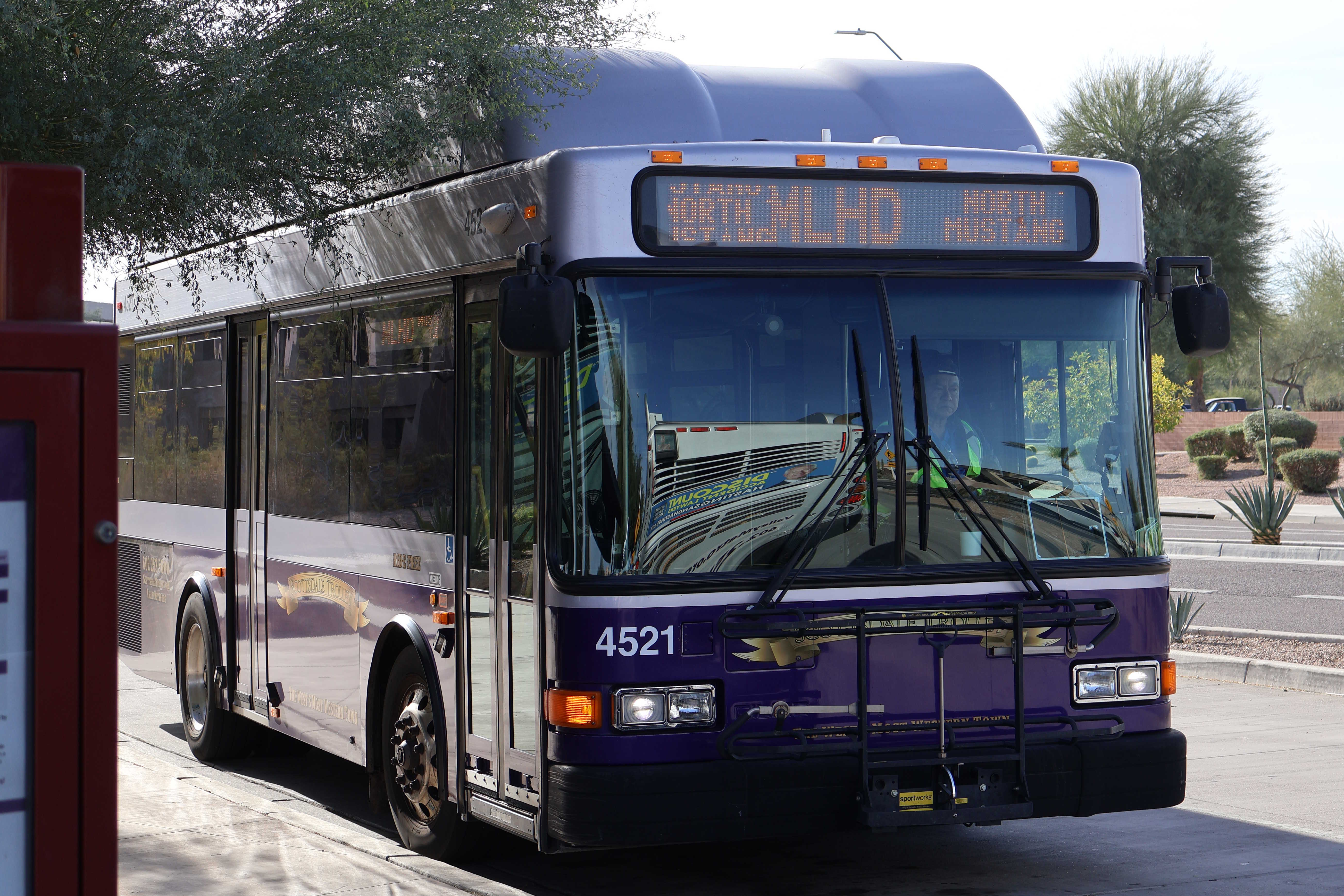 A purple and silver Scottsdale Trolley bus, number 4521, at Mustang Transit Center on the Miller/Hayden Trolley route to Mustang Transit Center