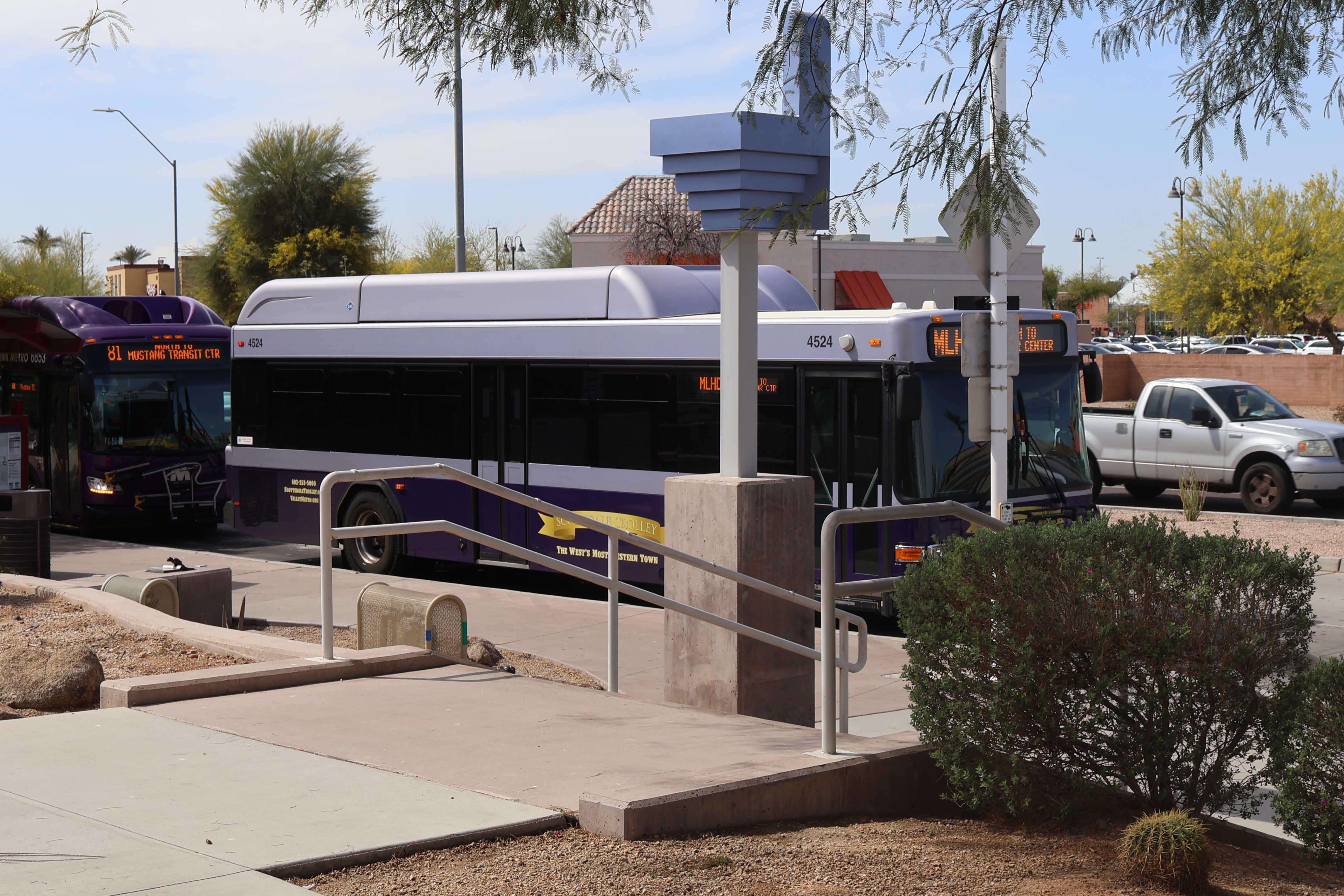 A purple and silver Scottsdale Trolley bus, number 4524, at Mustang Transit Center on the Miller/Hayden Trolley route to Granite Reef Senior Center
